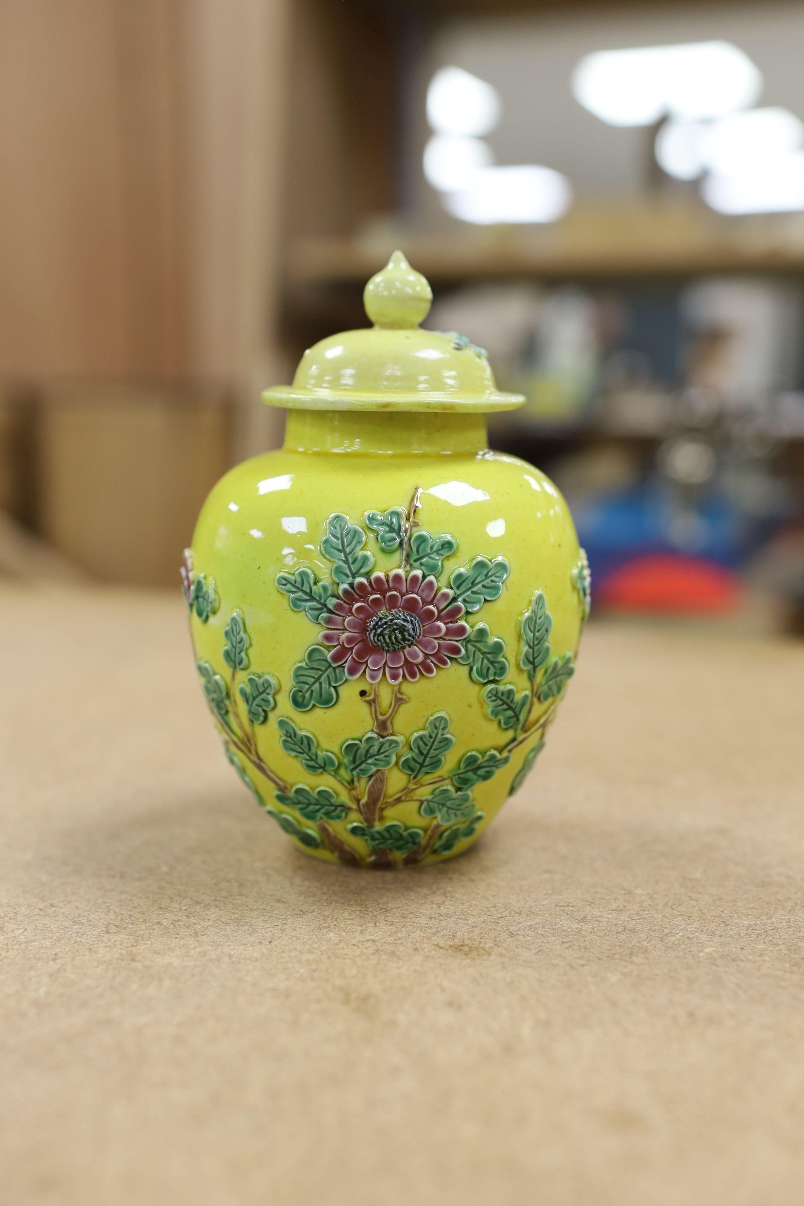 A Chinese enamelled yellow-ground jar and cover, a pottery teapot and cover and a flambe vase, latter 13cm